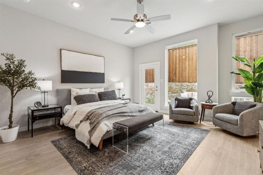 Bedroom with light hardwood / wood-style flooring and ceiling fan