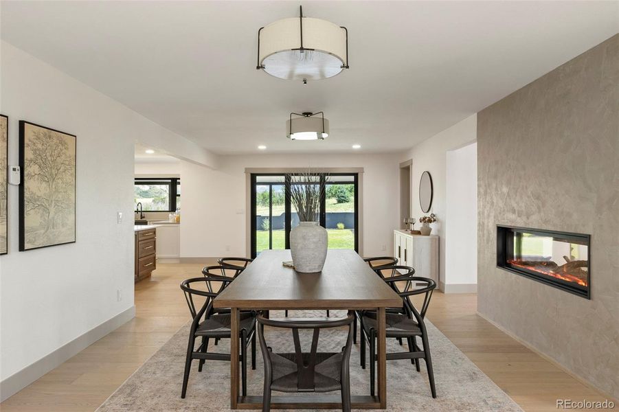 Large dining area with folding door to backyard