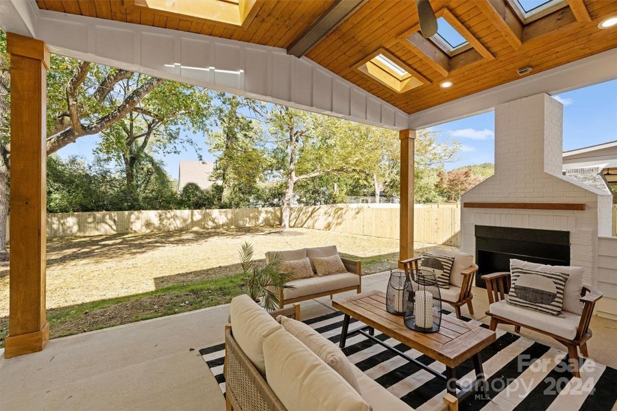 Covered back patio with skylights and fireplace