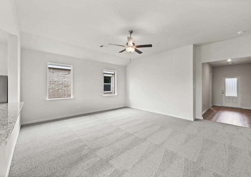 The spacious family room is perfect for family living and hosting.