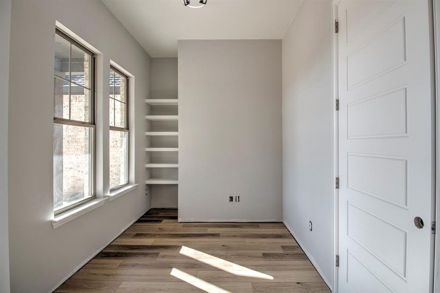 Unfurnished room with dark hardwood / wood-style floors