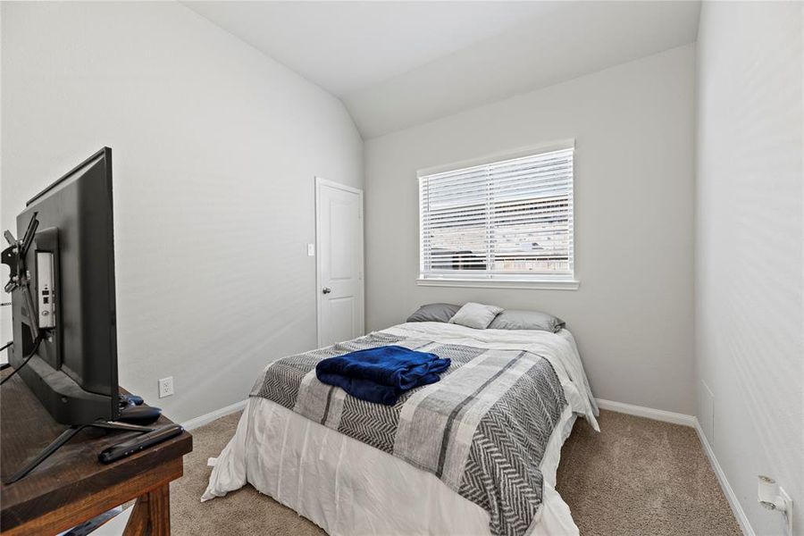 Another secondary bedroom with a walk-in closet