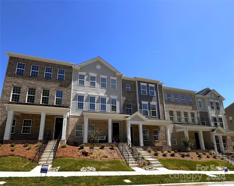 BEAUTIFUL 3 STORY TOWNHOME FEATURES BRICK AND HARDIPLANK EXTERIOR