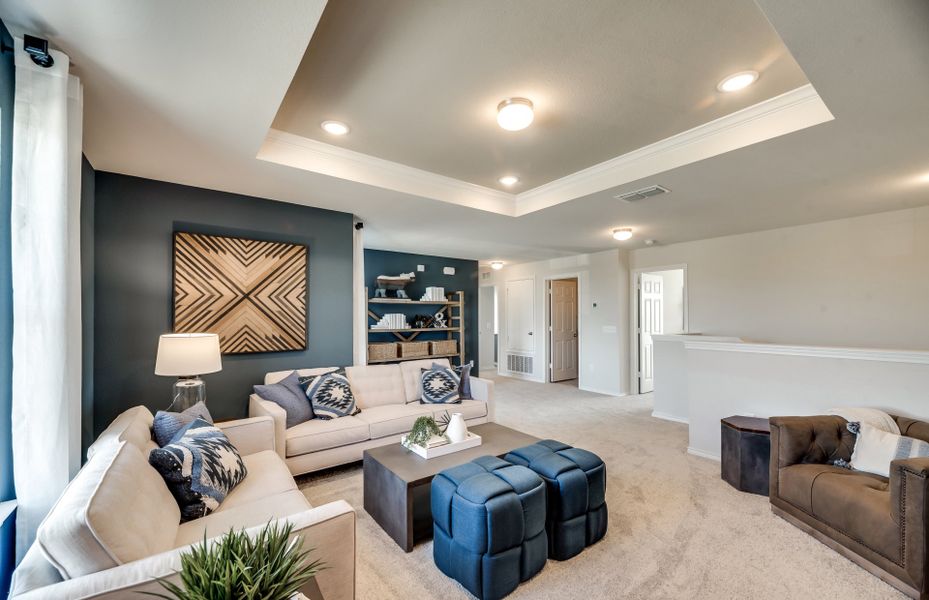 Spacious game room on second floor with recessed lighting