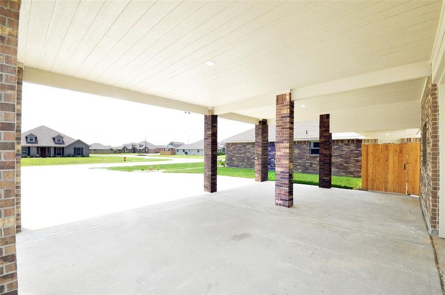 Notice the width and length of the driveway to the detached garage.