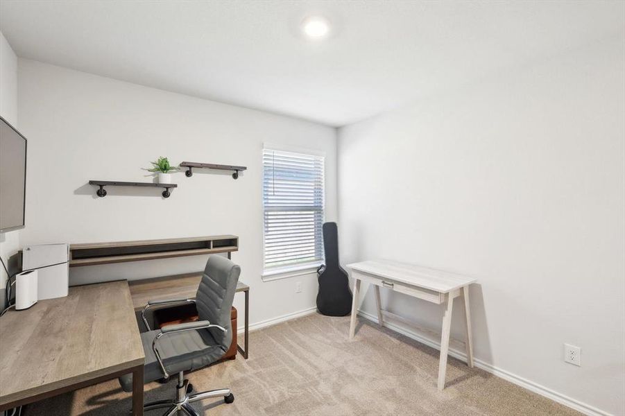 Office area with light colored carpet