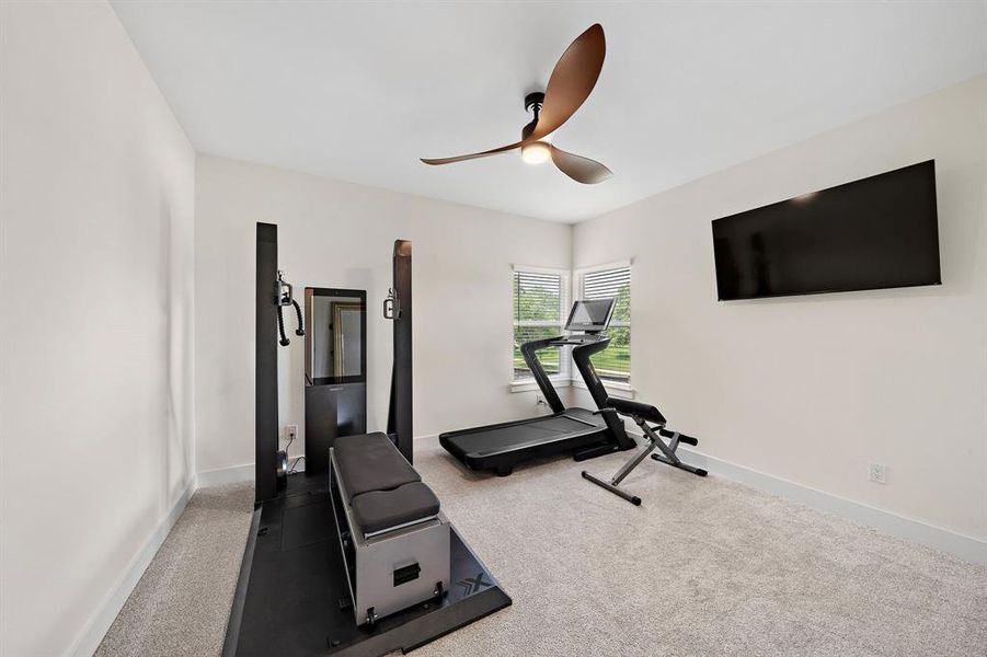 Secondary Bedroom 1 currently serving as a workout area, offering versatility to suit your lifestly needs.