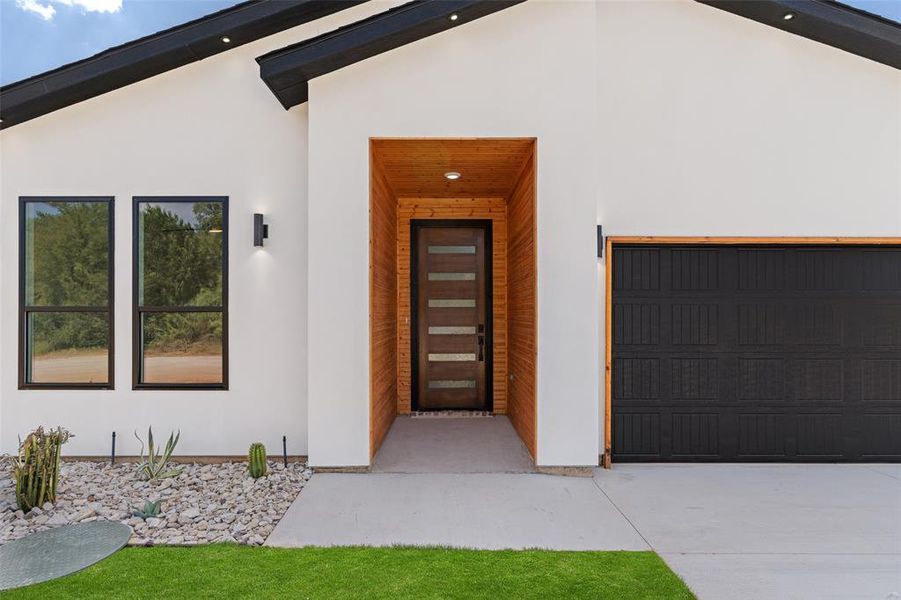 Property entrance with a garage