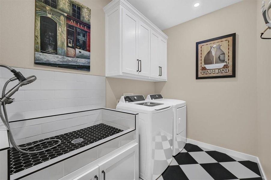 Washroom featuring built in cabinets and dog wash area