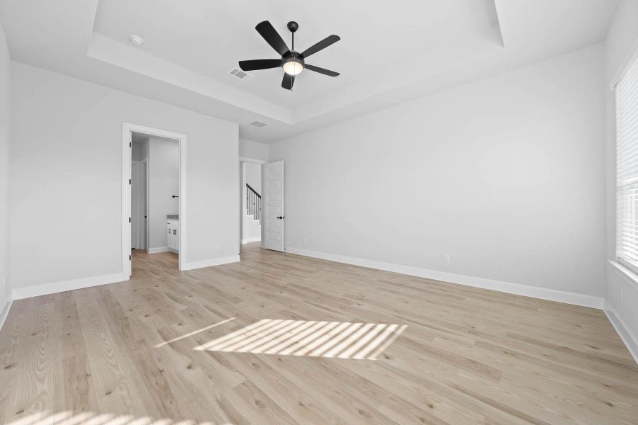 Master bedroom is downstairs with stunning vinyl flooring.