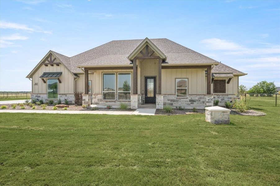 View of front of property featuring a front lawn