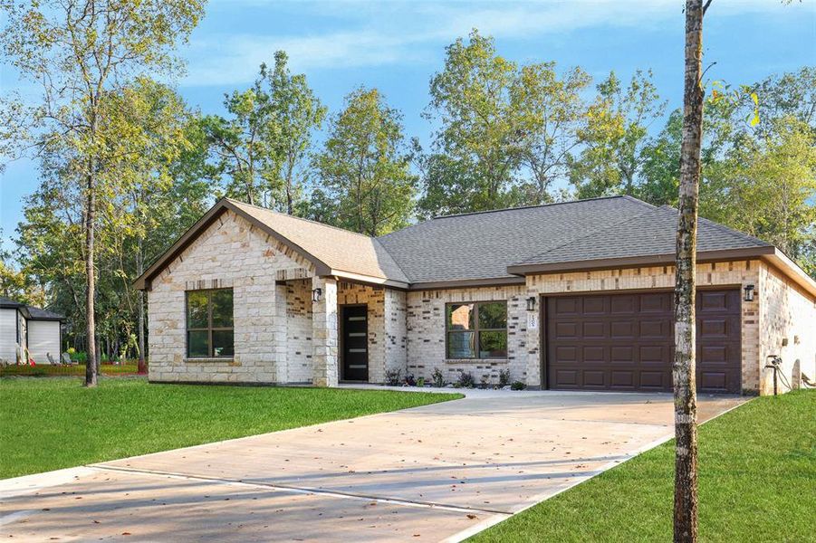 The exterior of the house features a combination of brick and stone on all sides.