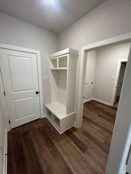 Mudroom with dark wood-type flooring