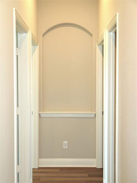 Hallway featuring dark hardwood / wood-style flooring