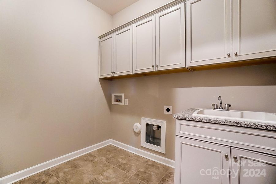 Laundry Room with Sink and Cabinets-Similar to Subject Property