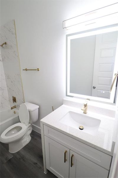 Full bathroom for bedroom number 2 on the first floor. Bathroom features led backlit mirrors, large under Mount sink, brushed gold faucets and hardware.