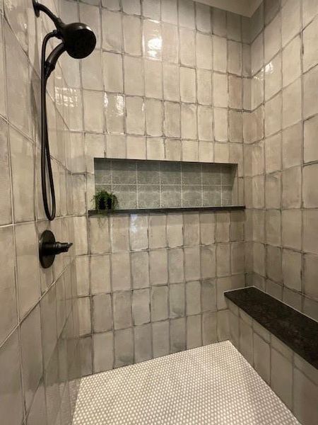 Bathroom featuring tiled shower