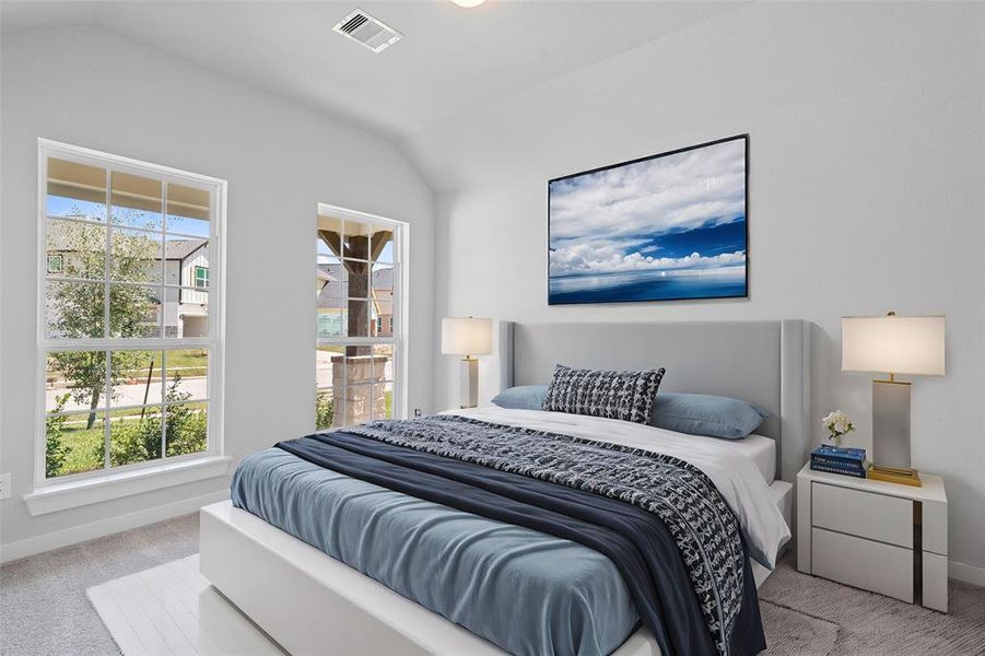 Secondary bedroom features plush carpet, custom paint, lighting, and a large windows with privacy blinds. This secondary bedroom has its own private access to a secondary bathroom.