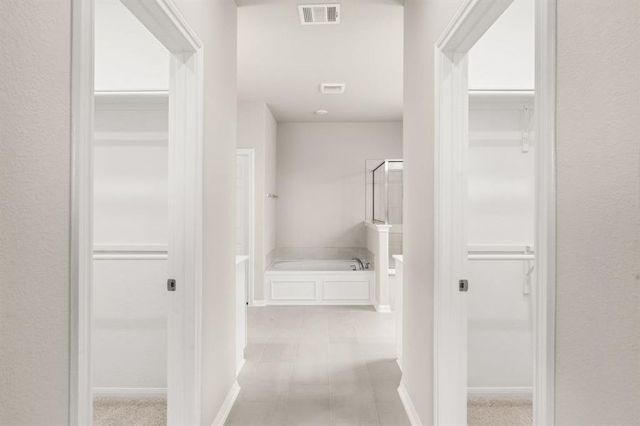 A view of your his and hers walk-in closets.
