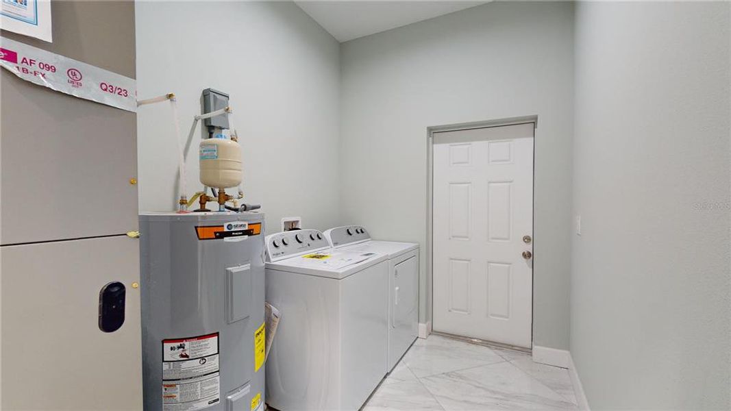 Indoor Laundry Room with Door to Backyard