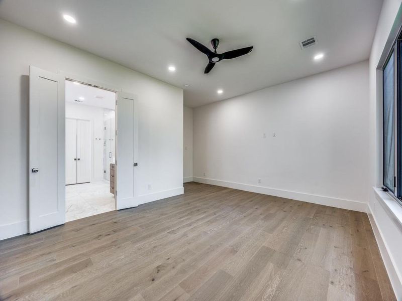 Unfurnished room featuring light hardwood / wood-style flooring and ceiling fan