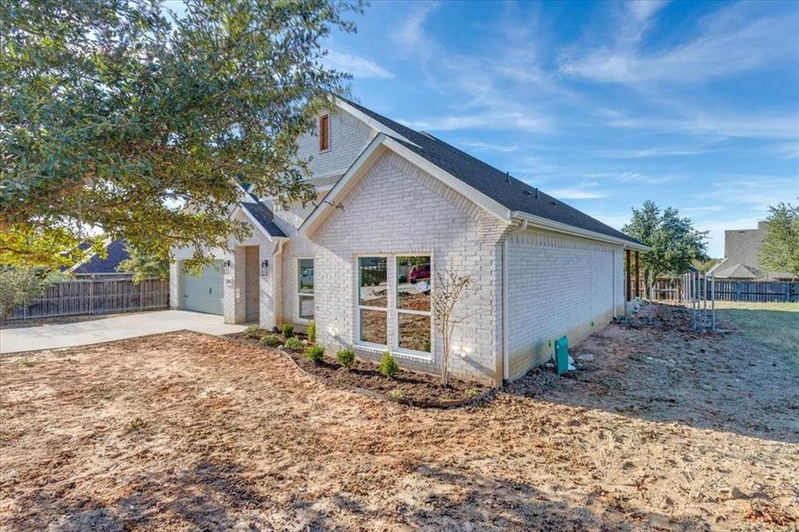 View of side of home featuring a garage