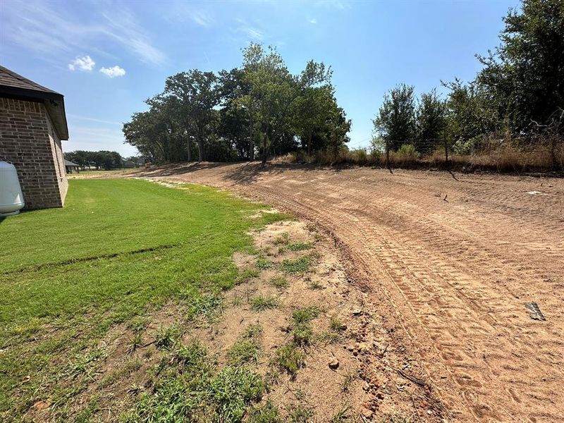 the yard was recently regraded, there is so much more space