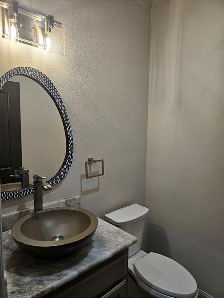 Bathroom with vanity and toilet