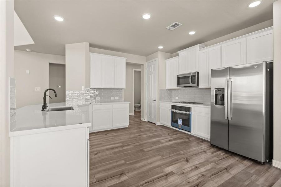 This kitchen is not only a functional space but also has ample storage. Whether you're a seasoned chef or just love to gather and enjoy good food, this kitchen is a dream come true.