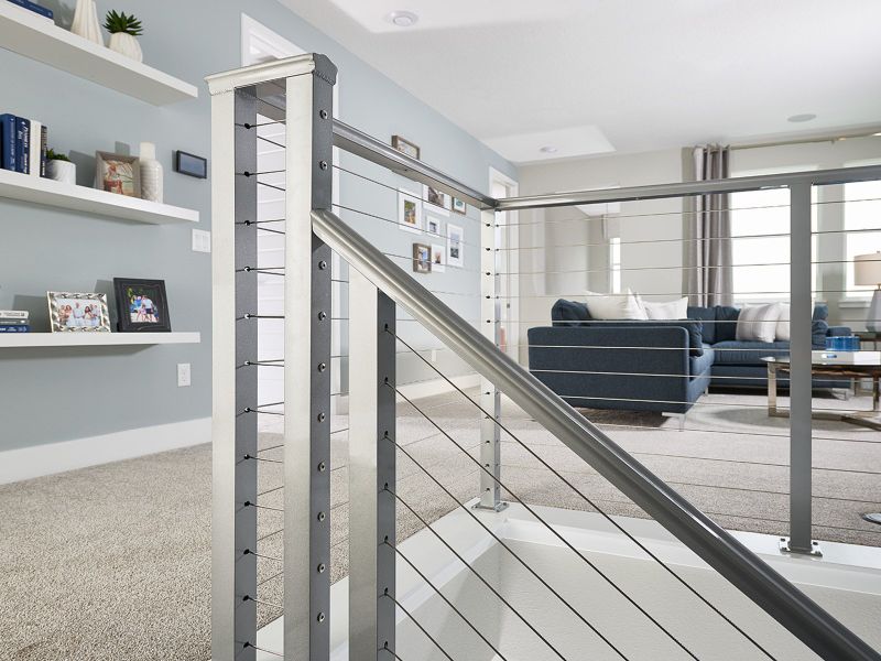 This home showcases modern features throughout the home including this beautiful staircase.