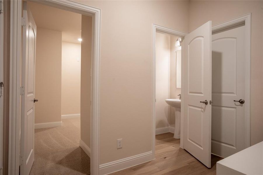 Hallway featuring light hardwood / wood-style flooring