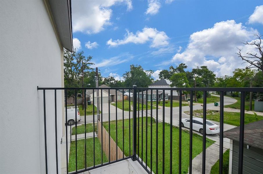 Step into luxury on your private balcony! Adorned with elegant ceramic tile flooring and a timeless wrought iron railing, this outdoor oasis provides a perfect blend of style and durability.