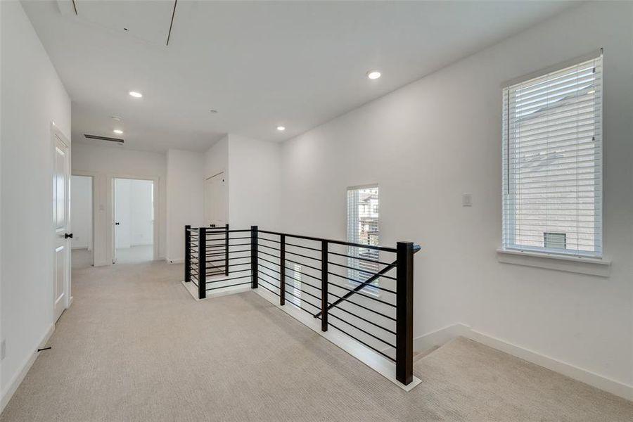 Hallway with light carpet