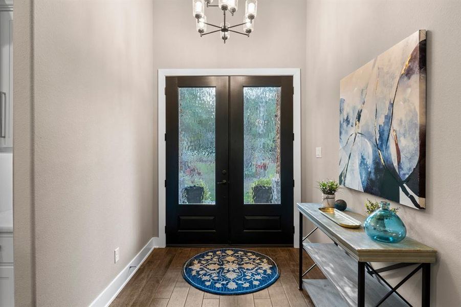 Welcome inside 117 Shadowlane Ct, featuring gorgeous glass and wood double doors.