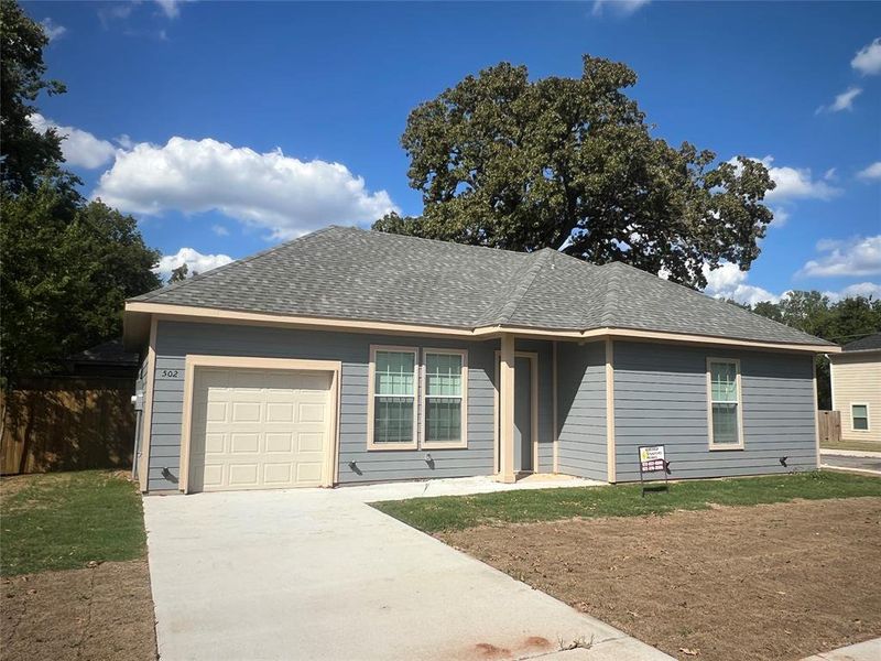 Single story home featuring a garage