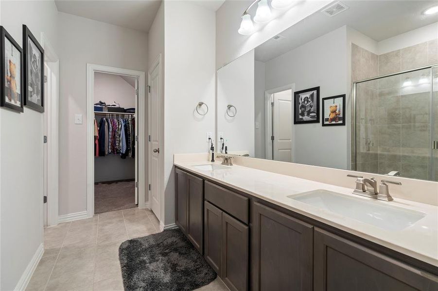 Double sinks in your primary bedroom.