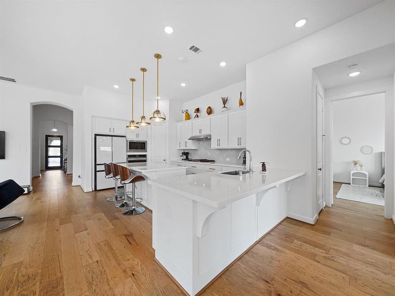 This inviting breakfast bar adds extra seating and charm to your space, making it perfect for casual meals.