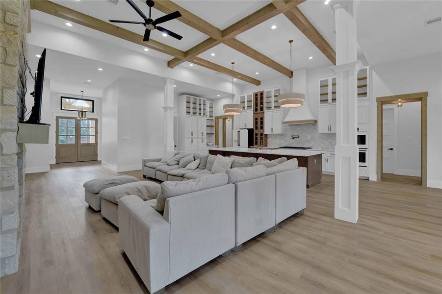 Family room features wood beams