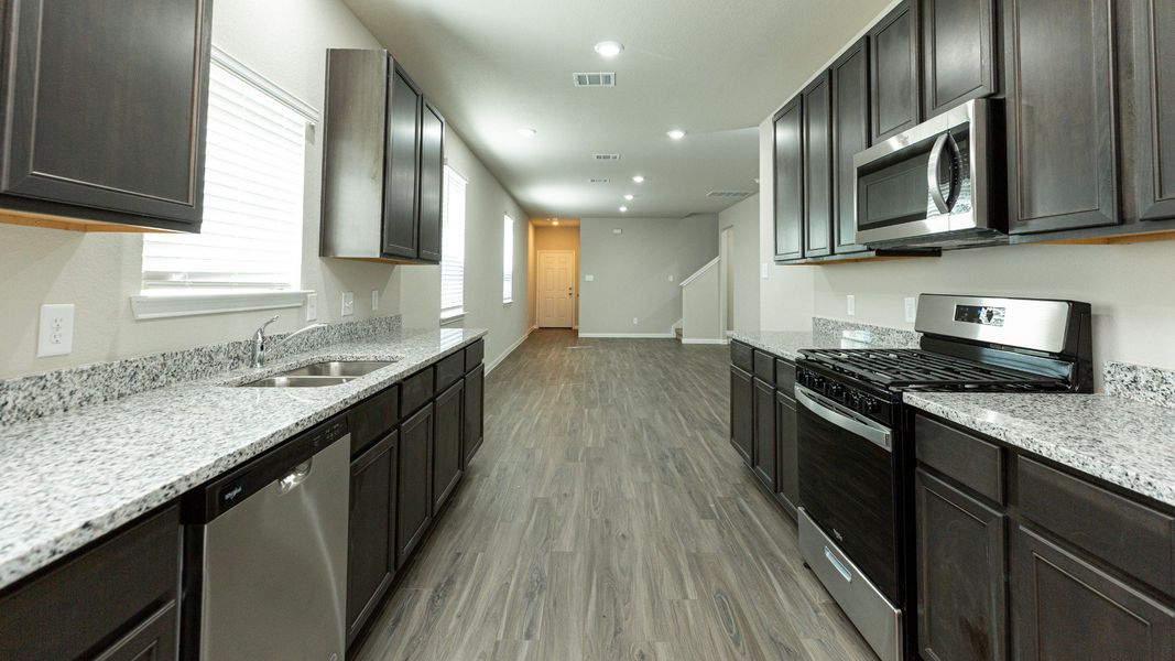 Kitchen to Dining Area and Family Room