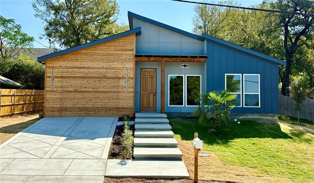 Contemporary home featuring a front yard