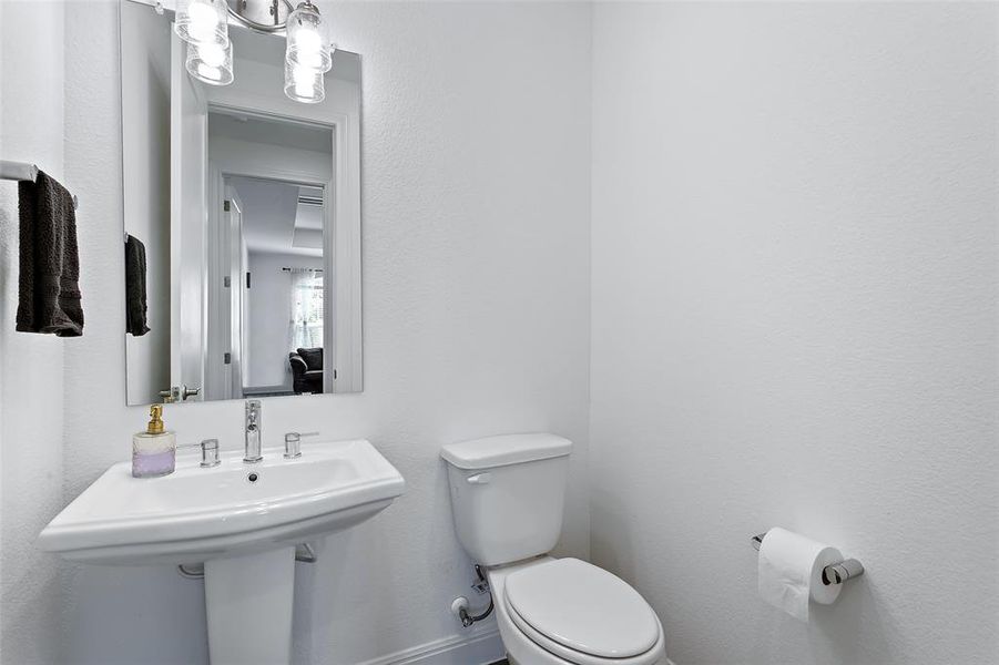 conveniently located off the front hall across from the study this powder bath allows for easy access