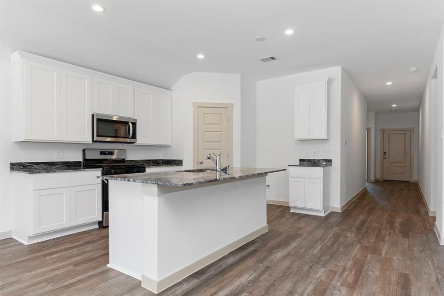 Open the door to your outstanding Walk In Pantry for all your storage needs! Notice all the Interior Doors are the Upgraded Beautiful 5 Panel Shaker Doors for that custom look! You will be surrounded with Beautiful Granite Countertops! **Image Representative of Plan Only and May Vary as Built**