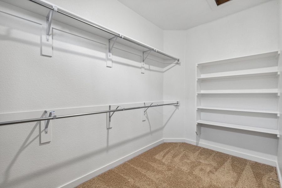 Primary Closet in the Oak II home plan by Trophy Signature Homes – REPRESENTATIVE PHOTO