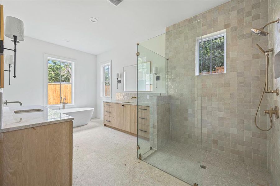 Bathroom with vanity and separate shower and tub