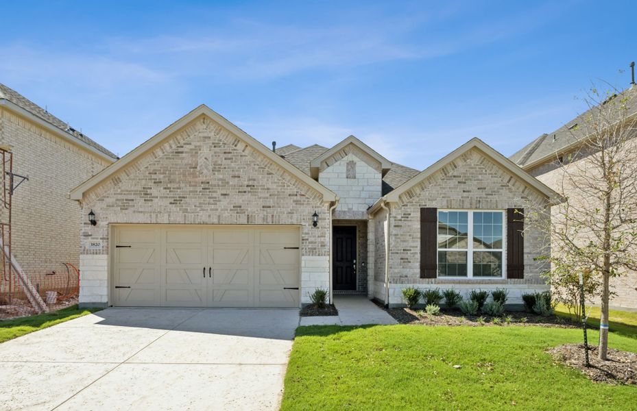 The Mooreville, a two-story new construction home with 2-car garage, shown with Home Exterior B