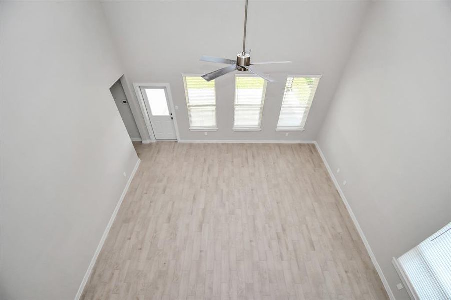 View of family room from above. Sample photo of completed home with similar floor plan. Actual colors and selections may vary.