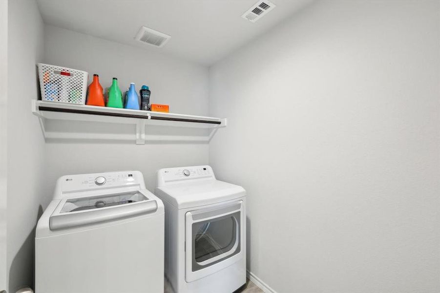 Washroom featuring washing machine and clothes dryer