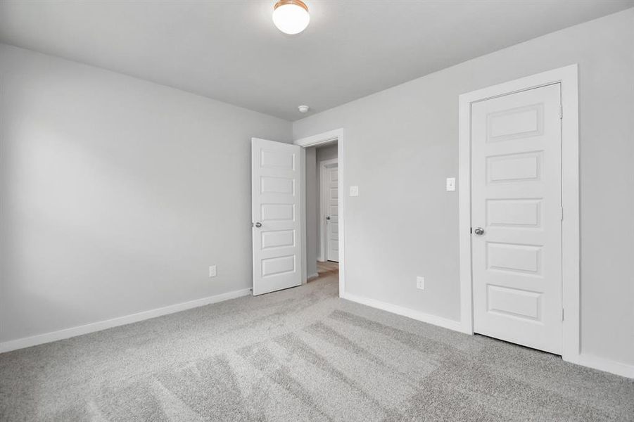 Generously sized secondary bedrooms, complete with spacious closets and soft, inviting carpeting.