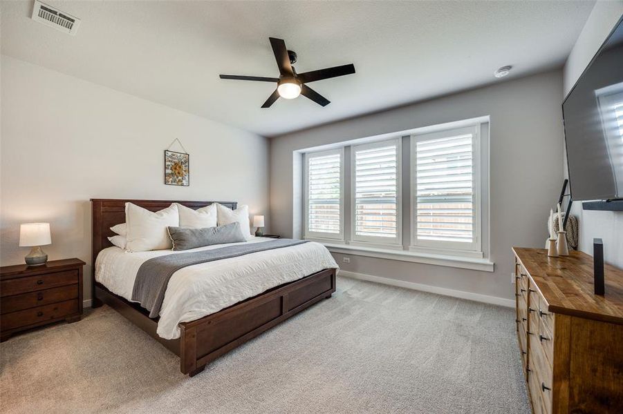 Primary Bedroom featuring carpet and ceiling fan