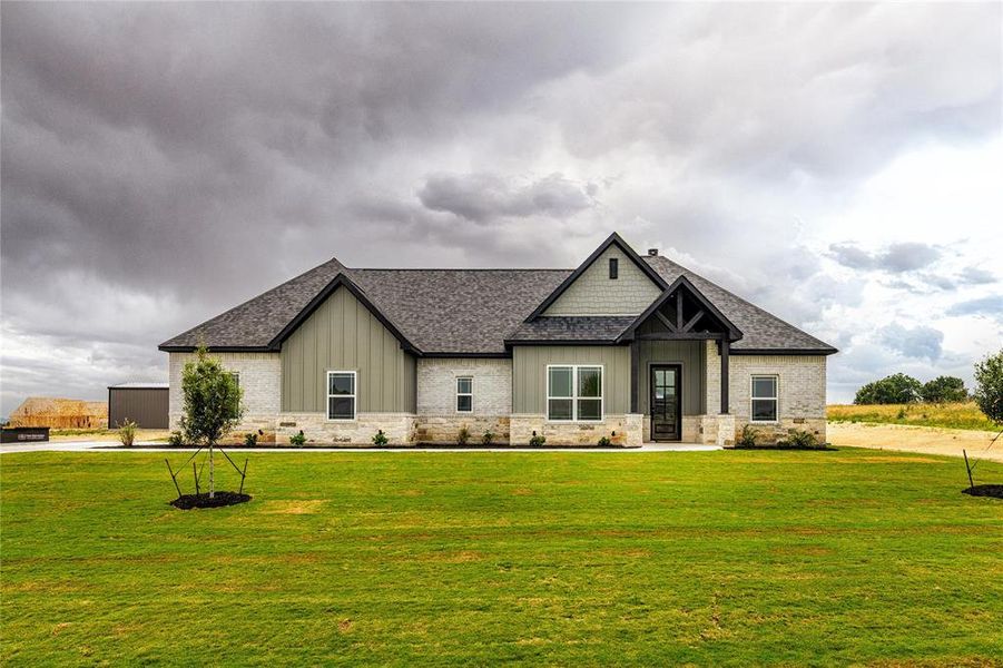 View of front of home featuring a front lawn